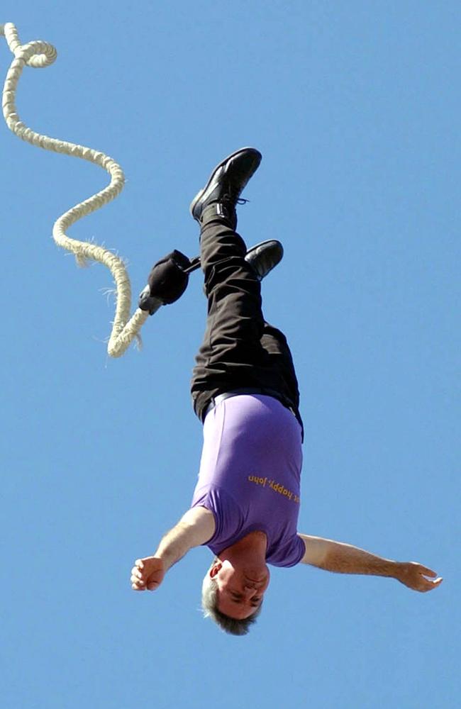 Going down ... and staying down. Democrats leader Andrew Bartlett bungee jumping at Surfers Paradise during the 2004 Federal election campaign. Picture: Paul Riley