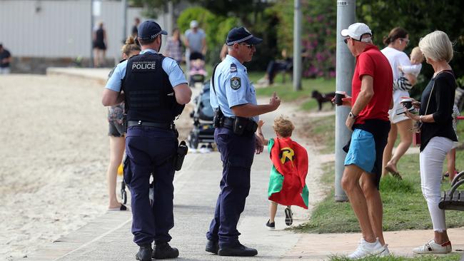 Coronavirus patrol ... NSW police speak to citizens at Double Bay. Picture: Matrix