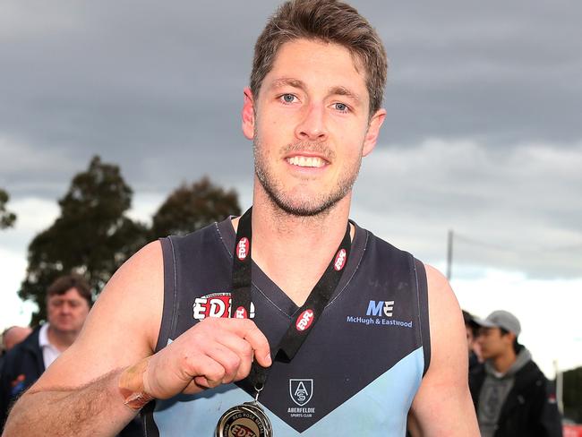 Luke Blackwell shows off his Reg Rose Medal after the 2018 grand final. Picture: Mark Dadswell