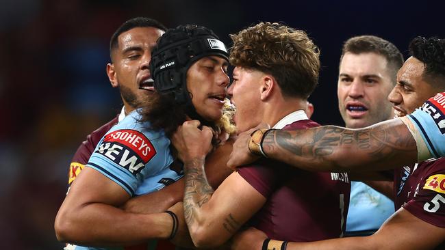 Luai and Walsh discussing matters during last year’s second game in Brisbane. (Photo by Chris Hyde/Getty Images)