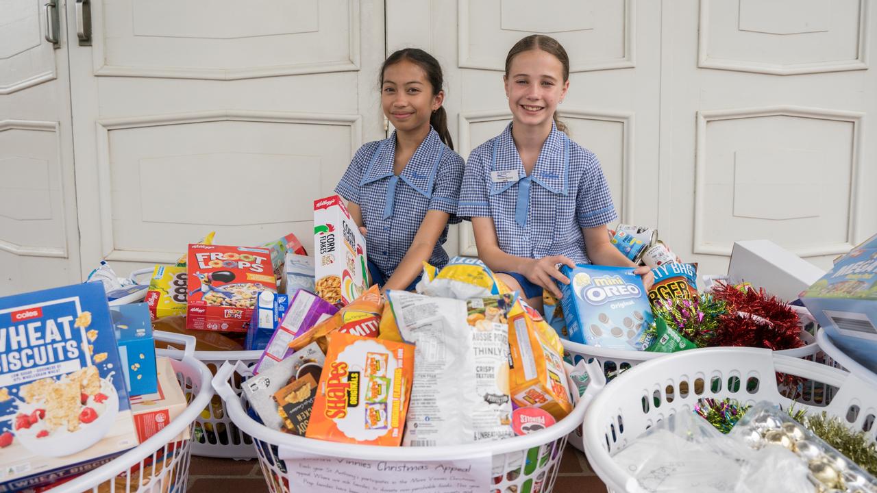 Students Sophia Senagan and Charlotte Edward with a number of hampers collected from students at St Anthony's Primary School. The St Vincent de Paul's Christmas appeal has meant hundreds of hampers have gone out to families in need this Christmas. Picture: Christine Schindler