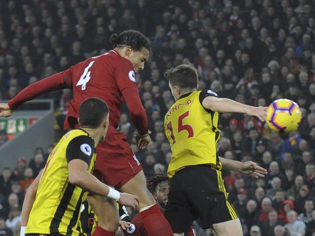 Liverpool's Virgil van Dijk, top left, scores his side's fifth goal during the English Premier League soccer match between Liverpool and Watford at Anfield stadium in Liverpool, England, Wednesday, Feb. 27, 2019. (AP Photo/Rui Vieira)