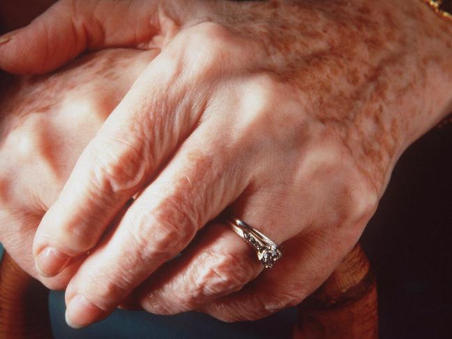 Old persons hands. People woman aged wedding and engagement ring - jewellery rings