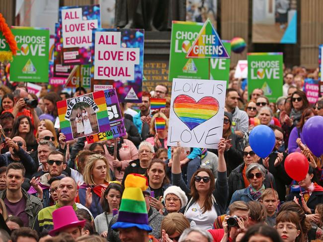 Supporters carried placards saying ‘Love is Love’ in Melbourne CBD. Picture: Scott Barbour/Getty Images