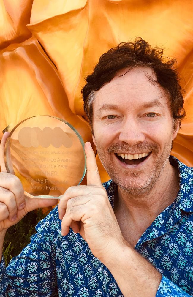 Big Pineapple Music Festival organiser Mark Pico with an award the event has won in previous years.