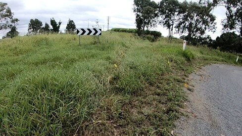 Car tracks can be seen on the ground leading into the dam. Photo: Contributed.