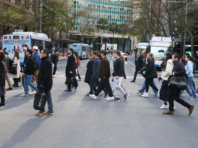 SYDNEY, AUSTRALIA : NewsWire Photos JUNE 17 2024:Sydney siders are seen in the CBD early this morning on the commute to work as reports a cold front is moving in. Picture: Newswire / Gaye Gerard