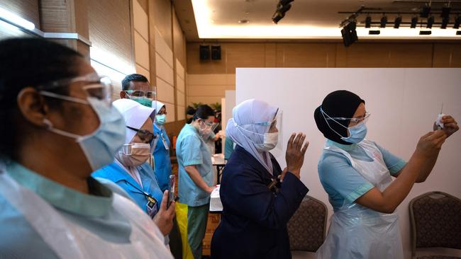 Staff prepares to administer the Pfizer-BioNTech coronavirus vaccine at Sunway Medical Center in Jaya. Picture: AFP