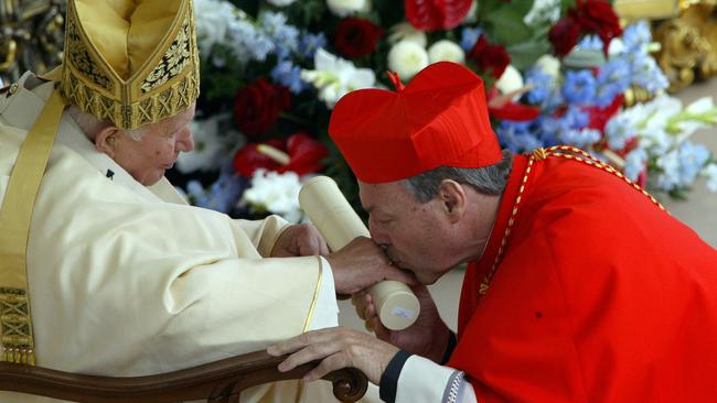 Pell receives his red hat from Pope John Paul II in St Peter's square at the Vatican. Picture: AFP PHOTO VINCENZO PINTO 