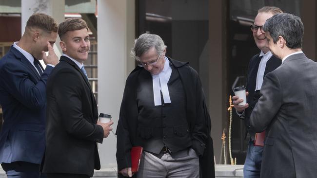 NRL player Jack De Belin and co-accused Callan Sinclair speak to their legal team. Picture: Simon Bullard