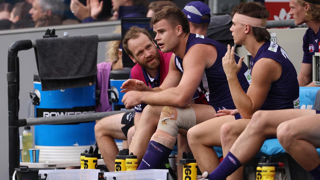 PERTH, AUSTRALIA - APRIL 11: Sean Darcy of the Dockers looks on from the bench during the round four AFL match between the Fremantle Dockers and the Hawthorn Hawks at Optus Stadium on April 11, 2021 in Perth, Australia. (Photo by Paul Kane/Getty Images)