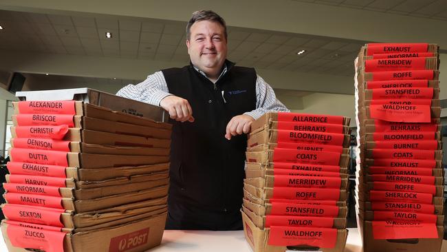 Tasmanian Electoral Commissioner Andrew Hawkey preparing for the arrival of ballot papers to begin counting in the local government elections. Picture: NIKKI DAVIS-JONES