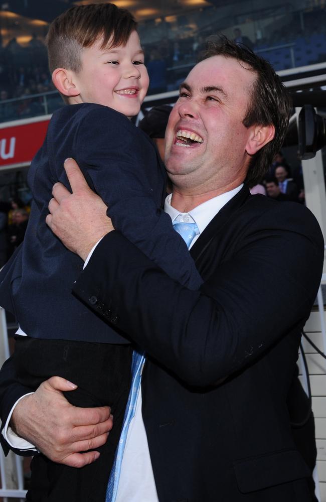 Special moment on a special day: Shea Eden celebrates with his son Blake after winning his first Group 3 race. Picture: Getty Images