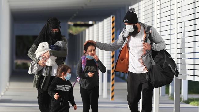 Richmond player Bachar Houli and his family arrive at Coolangatta to join his teammates in the AFL bubble in Queensland. Picture: Adam Head