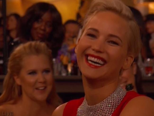 Jennifer Lawrence laughs along with the joke.