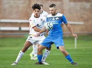 STAR STRIKER: South West Queensland Thunder striker Anthony Grant (right) shields the ball from Magpies Isaiah Kennell. The club's 2018 leading goal-scorer will be a key man again this season. Picture: Nev Madsen