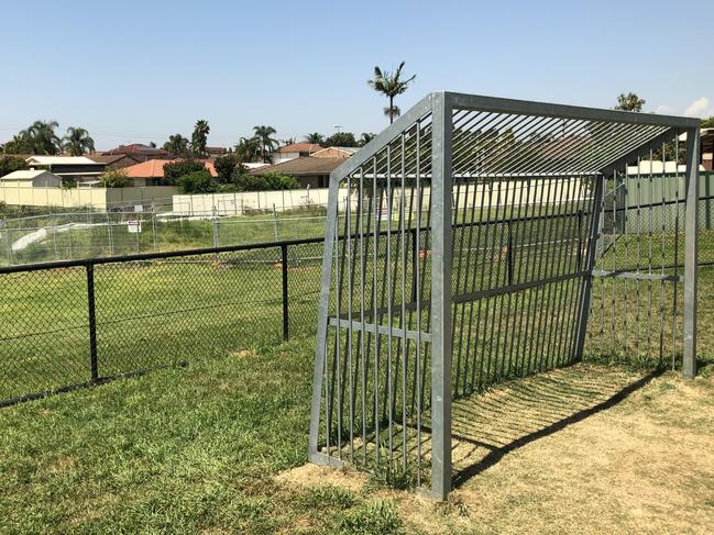 A soccer goalpost with the asbestos fencing visible in the background. Picture: Tony Ibrahim