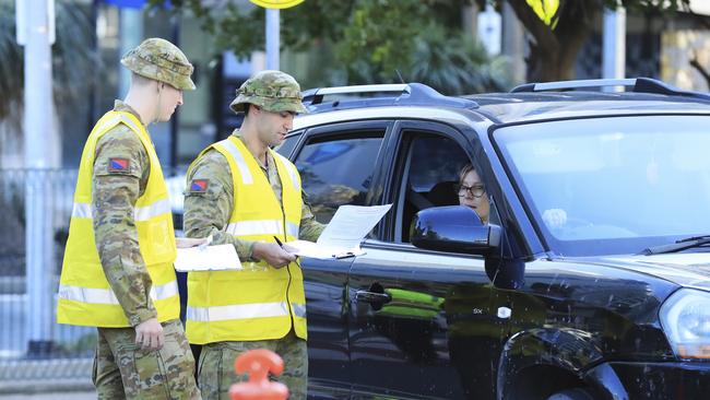 Australian Defence Force personnel assist Queensland Police at the Griffith St, Coolangatta checkpoint. Picture: Scott Powick.