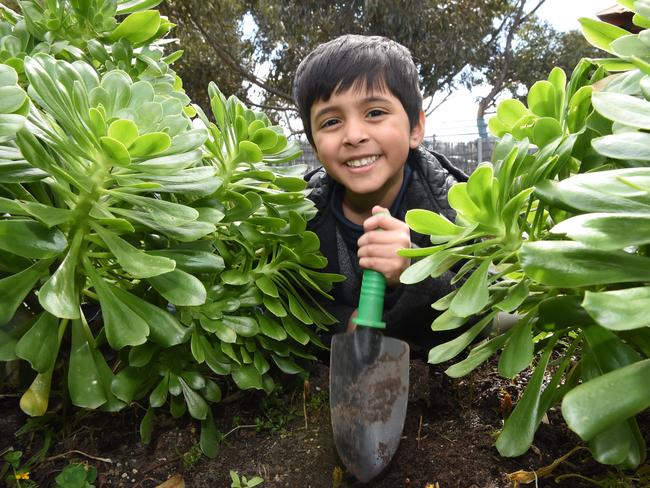 Razin does a bit of gardening at Jindi Woraback Children's Centre, one of eight Victorian centres rated “excellent”. Picture: Tony Gough