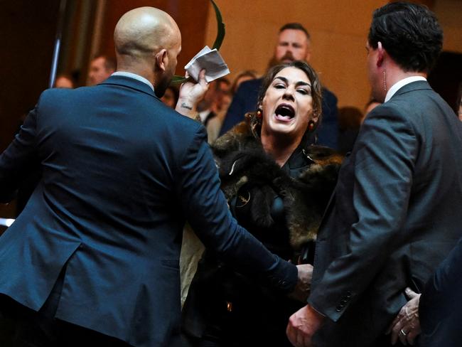 Australian Senator Lidia Thorpe stages a protest as Britain's King Charles and Queen Camilla attend a Parliamentary reception in Canberra, Australia - 21 Oct 2024. Victoria Jones/Pool via REUTERS TPX IMAGES OF THE DAY