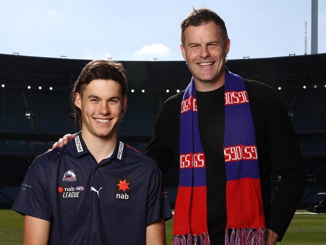 Luke Darcy chose to watch his son Sam (left) play footy over commentating. Picture: Michael Klein.