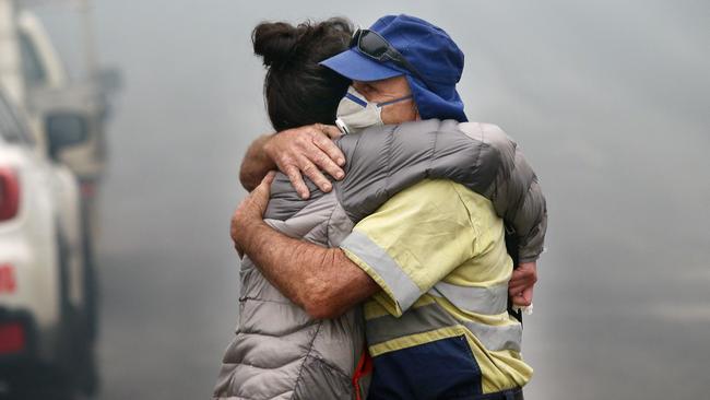 The morning after a devastating blaze destroyed homes and businesses in the small town of Cobargo. The town has been decimated by fire. Local resident Shona Taranto is comforted by Tim O'Mearo. Shona Taranto was the owner of one of the small businesses that was destroyed in the Main Street when the fire ripped through the small community of Cobargo. Picture Gary Ramage