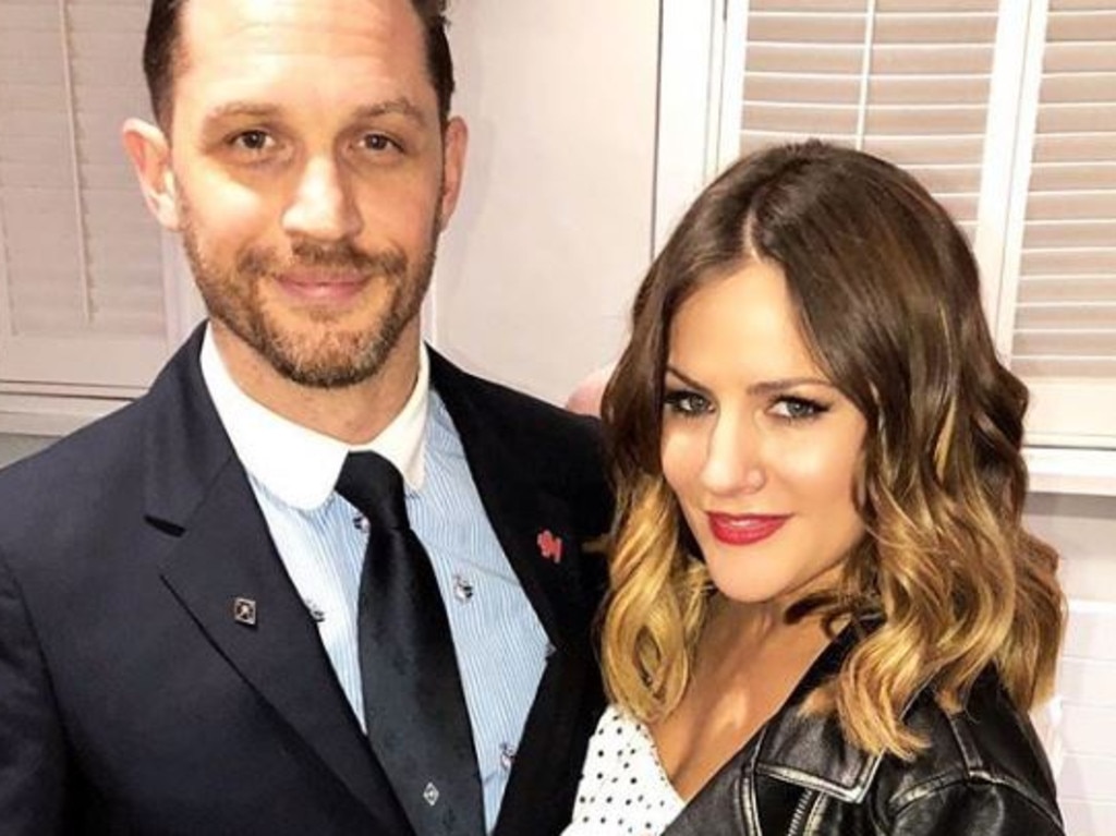 Caroline Flack, pictured with Tom Hardy, is the face of hit TV shows including <i>X Factor</i> and <i>Love Island UK. </i>
                     