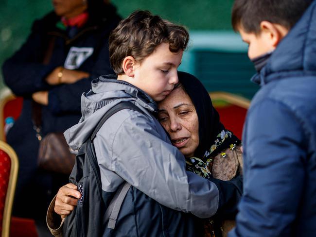 Fatma Korkma, sister of Sozcu newspaper columnist and journalist Nedim Turkmen, (C) reacts during a funeral service for him, his wife and his two children killed during the ski resort fire. Picture: AFP