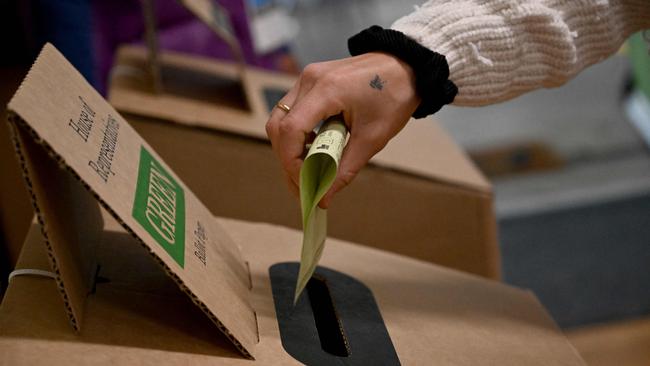 A resident casts his vote in a Cook electorate polling booth. Picture: SAEED KHAN / AFP)