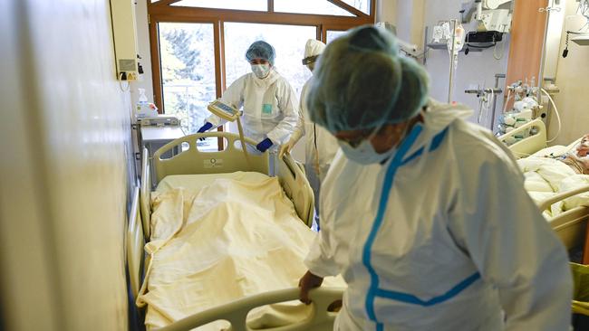 A medical staff member pushes a trolley bed carrying the body of a deceased Covid-19 coronavirus patient in the intensive care unit of Lozenets Hospital in Sofia, Bulgaria. Picture: AFP