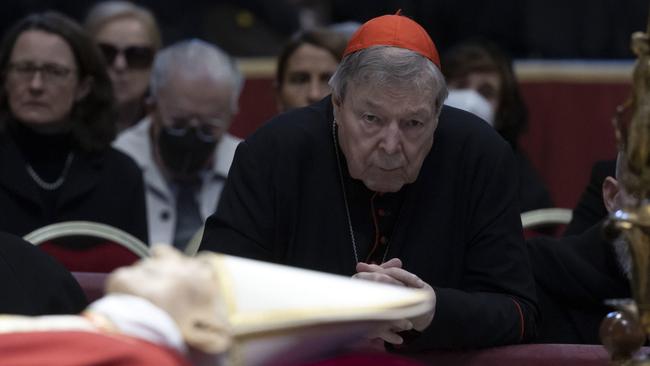 George Pell prays at the lying in state for Pope Benedict XVI on January 3. Picture: EPA