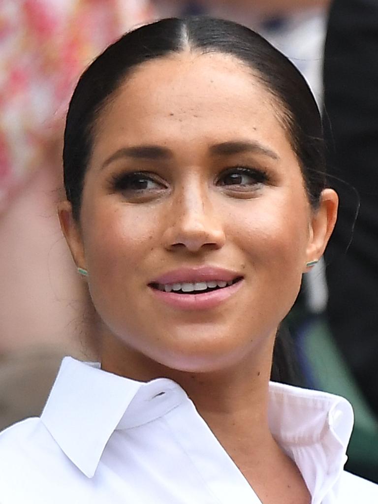 Meghan, Duchess of Sussex, sits in the Royal Box on centre court at Wimbledon to watch Serena Williams play in 2019. (Photo by Ben STANSALL / AFP)