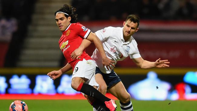 Manchester United’s Falcao and Bailey Wright in an FA Cup clash in 2015.