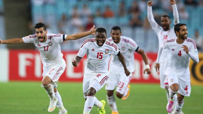 United Arab Emirates players celebrate after sending Japan home.