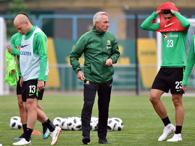 Australia's coach Bert van Marwijk (C) has steered the ship since January. Pic: AFP