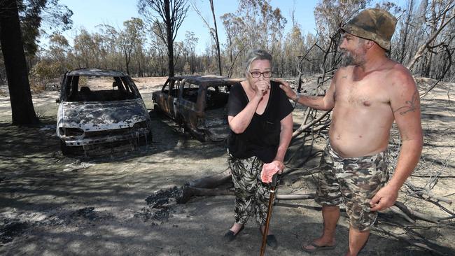 Elizabeth Clarke and Douglas Grist check the devastation. Photo: Annette Dew