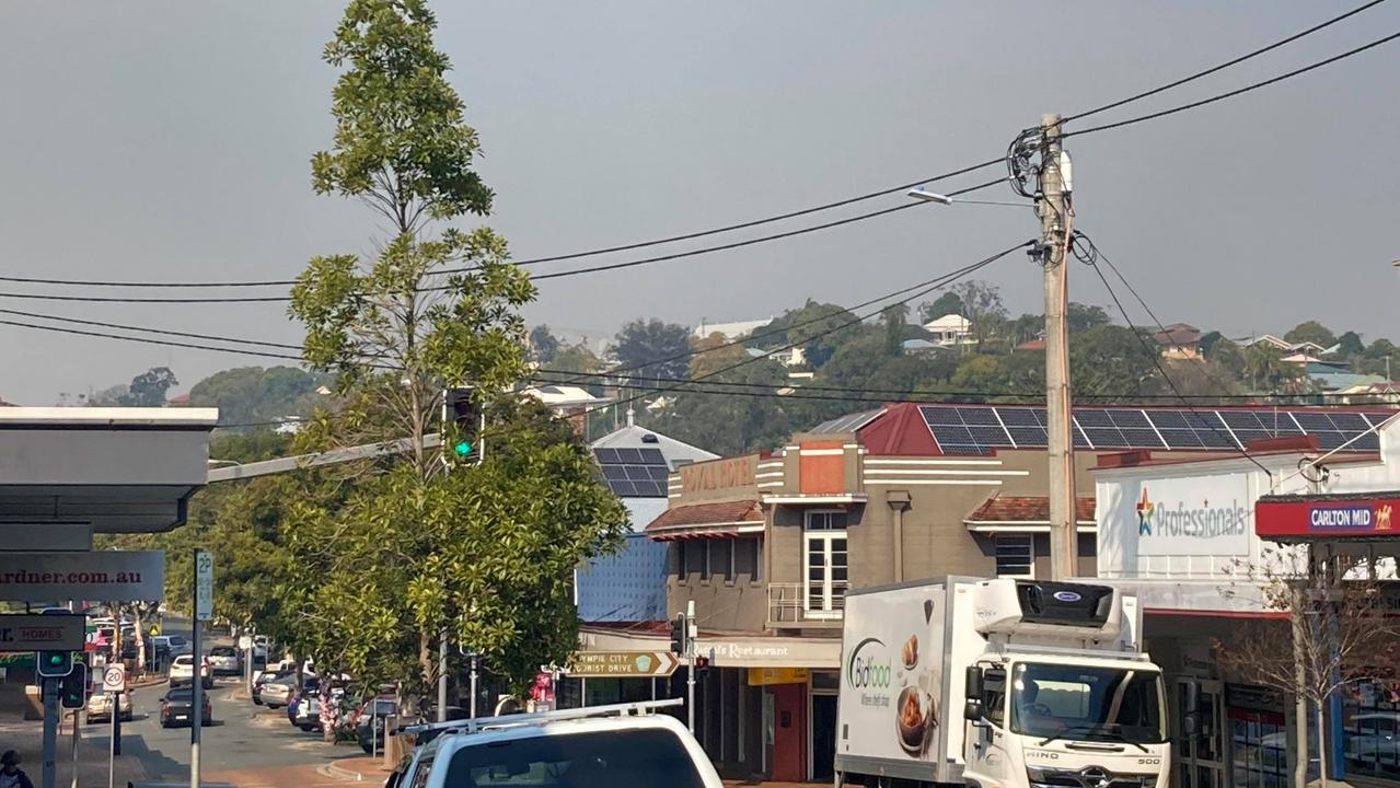 Smoke hangs over Gympie as Queensland Fire and Emergency Services and Queensland Parks and Wildlife Services conduct controlled burns across the region on Tuesday, July 27, 2021. Photo: Scott Kovacevic