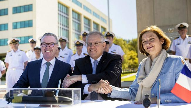 Prime Minister Scott Morrison with then Defence Minister Christopher Pyne (L) and France's Defence Minister Florence Parly (R) after signing the submarine Strategic Partnership Agreement in Canberra in 2019.