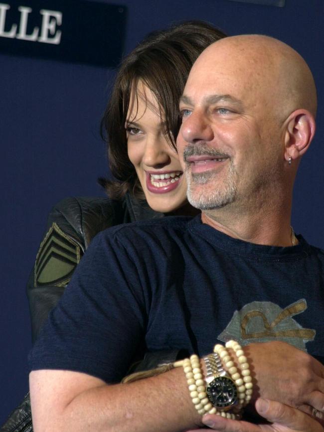 Argento poses with US director Rob Cohen, whom she has accused of sexual assault.