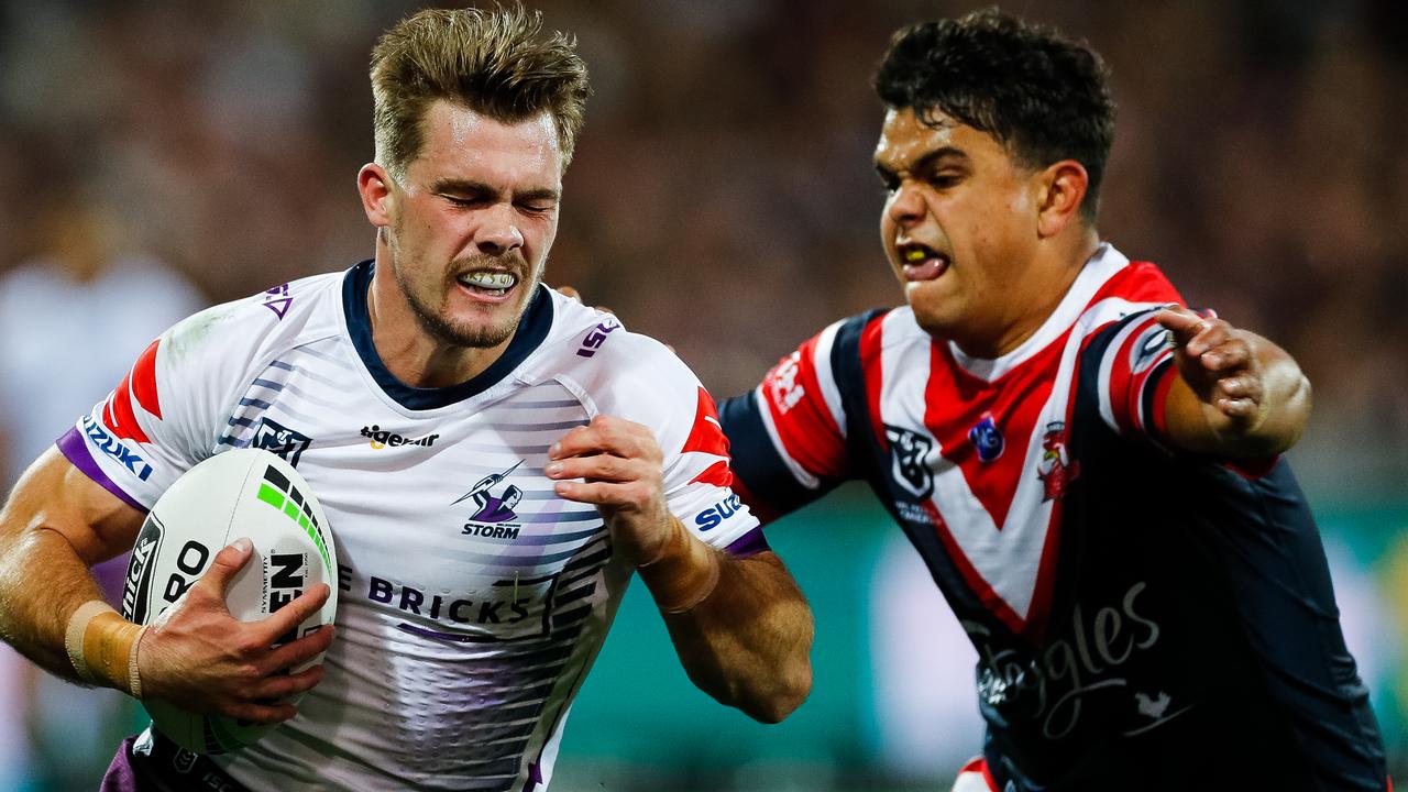 Ryan Papenhuyzen of the Storm is tackled by Latrell Mitchell of the Roosters. Both teams sit inside the premiers zone.