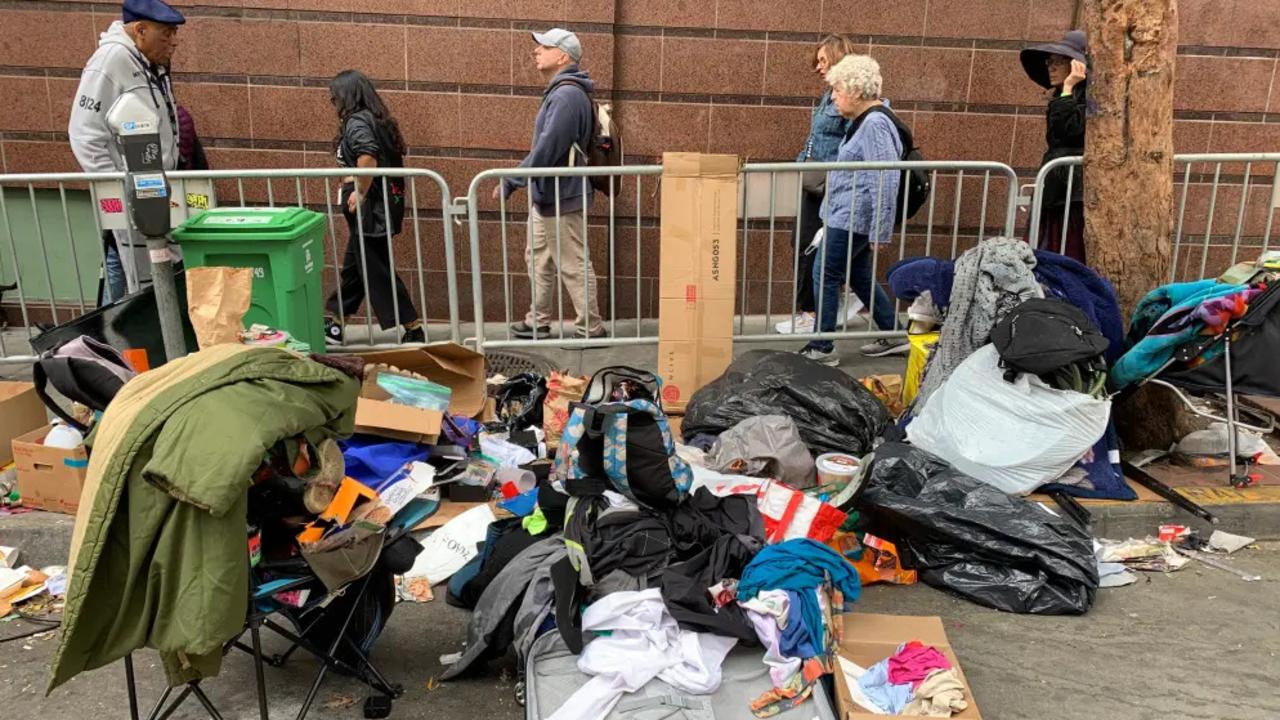 BEFORE: A homeless encampment on the street as tour participants of the "Celebrate Tenderloin Tour" walk through the Tenderloin District in San Francisco on Aug. 26, 2023. Picture: David G. McIntyre