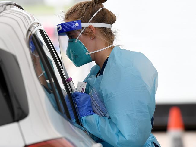 SYDNEY, AUSTRALIA - NewsWire Photos FEBRUARY, 12, 2021: Health workers dressed in Personal Protection Equipment (PPE) are seen at the St VincentÃs COVID-19 drive through testing clinic at Bondi Beach,Sydney. Picture: NCA NewsWire/Bianca De Marchi