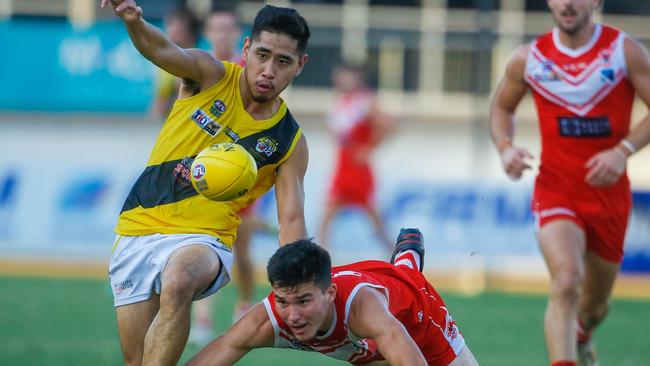 Tigers Ryan Mu and Tah's Ned Stephens in the NTFL Round 6game Waratah v Nightcliff in the men's Premier League. Picture GLENN CAMPBELL