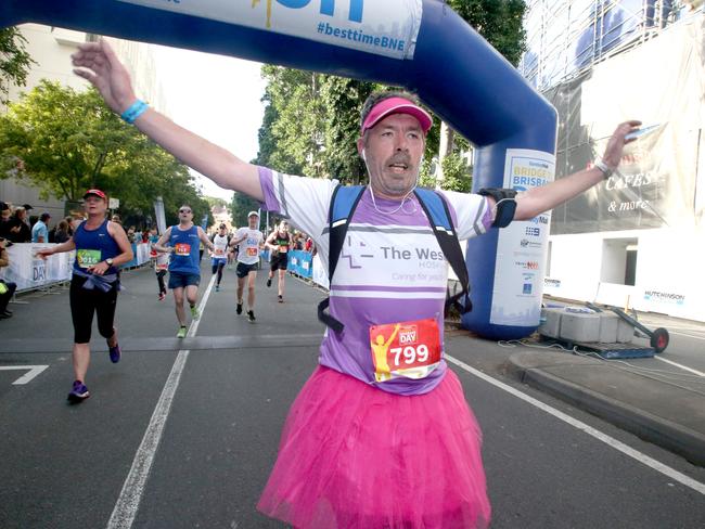 Matthew Enneve after running <i>The Sunday Mail</i> Bridge to Brisbane 2017. Picture: AAP/Steve Pohlner