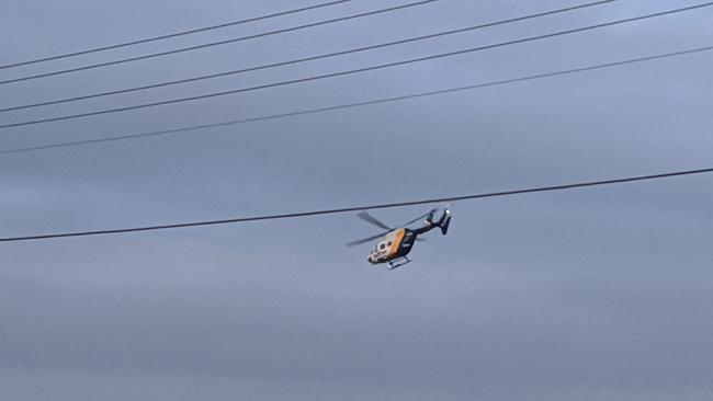 A Careflight helicopter flies above the scene in Leonay where 63-year-old Kathleen Young was hit by a car and killed. The driver faced court on Wednesday morning.