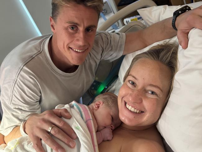 Tasmanian ironman champion Matt Bevilacqua and partner Brielle Cooper with their new baby Beau Peter born on the Gold Coast on May 28. Picture supplied by the family.