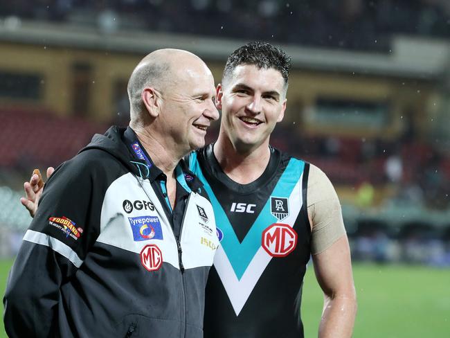 Port Adelaide coach Ken Hinkley with Tom Rockliff. Picture: Sarah Reed