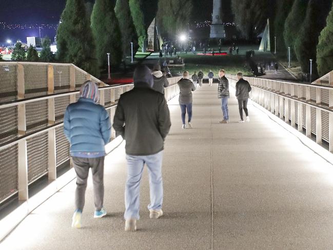 People cross Hobart's new Bridge of Remembrance on their way to the Anzac Day dawn service in Hobart. Picture: PATRICK GEE