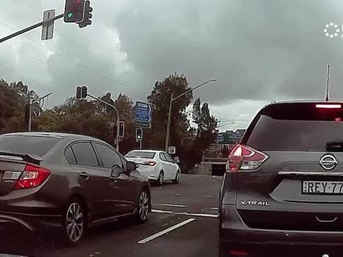 Cyclist sent flying after riding through red