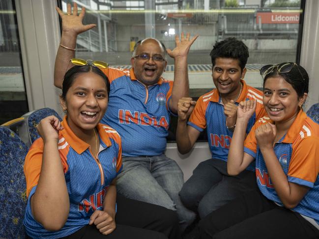 Satya and Sai Mandalika pictured cheering with their children Akshara - 13 and Ananya - 12 travelling together on the train to the SCG for the first day of the Pink Test. Picture: Monique Harmer